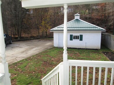 A view from the back porch showing the garage, con