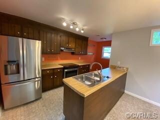 Galley Kitchen with newer stainless appliances.