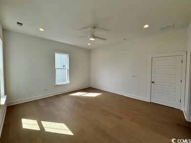 Unfurnished room with a ceiling fan, wood finished floors, baseboards, and recessed lighting