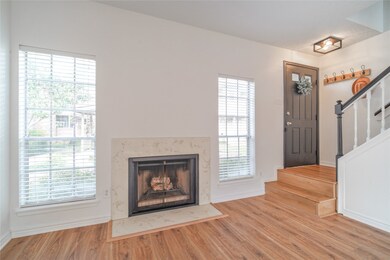 A cozy living room featuring a Wood-burning firepl
