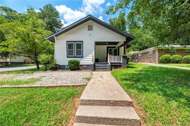 Bungalow-style home with a porch and a front yard
