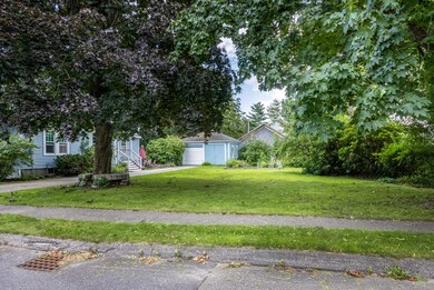 Side lot to the right of the driveway.