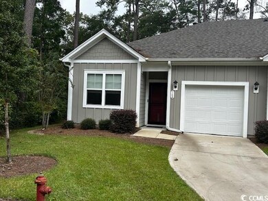 Ranch-style home with a garage and a front yard