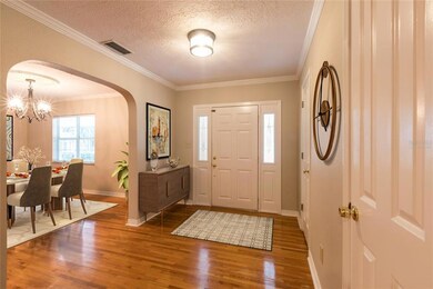 Virtually Staged Large Foyer and Dining Room