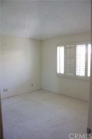 Second bedroom with plantation shutters, nice size