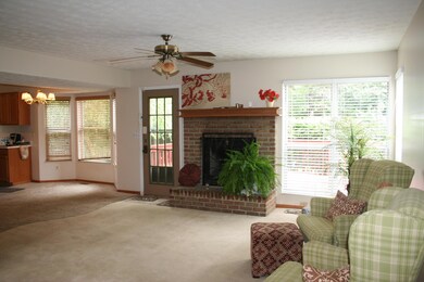 great room with brick fireplace