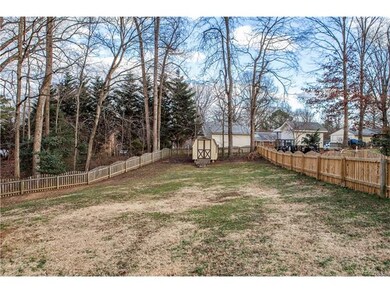 Spacious Fenced Back Yard with Storage Shed.