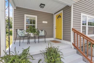 Charming front porch provides a warm welcome ~