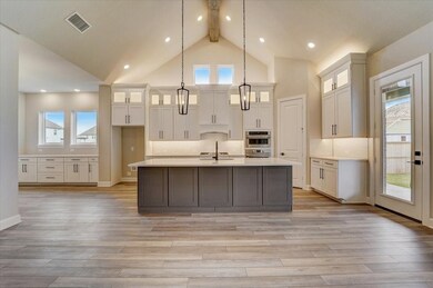 EXAMPLE PHOTO: Dramatic cathedral ceiling will imp
