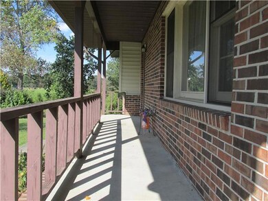 Beautiful Rocking Chair front porch overlooks part of the front yard!