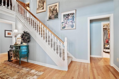 The Entry also features the staircase to the Upper