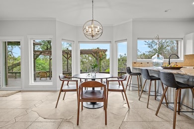 Dining space featuring a chandelier, ornamental m