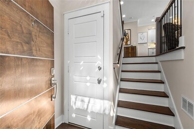 Entry Foyer & Door to Garage