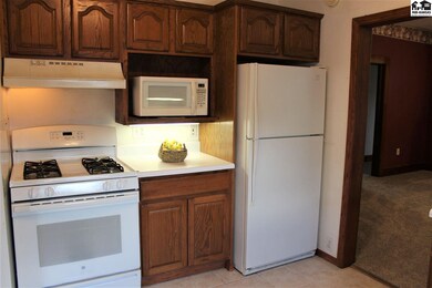 All the kitchen appliances, including stack W&D on