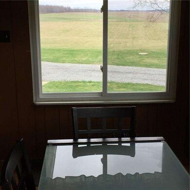 Eat-in Kitchen looking out towards back yard and a