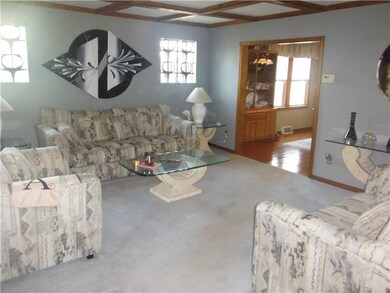 Living Room. Beamed ceiling. open to the Dining ro