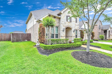 Sensational large lot, well-groomed landscaping, and a sprinkler system