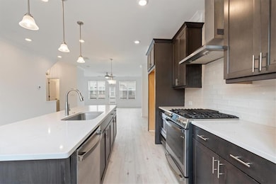 Kitchen featuring a sink, appliances with stainles