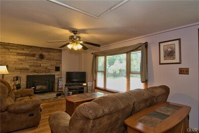 The living room features brand new laminate floori