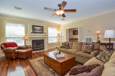 Living room area with double pane windows, wood fl