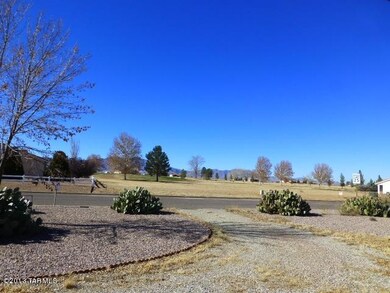 Golf course accross street.