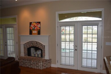 Wood Burning Fireplace and French Doors leading fr