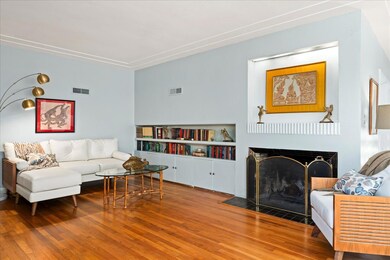 Living room featuring wood finished floors, a fir
