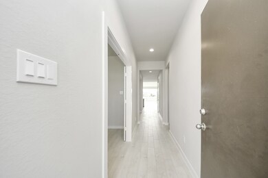 As you step into the threshold of this luxurious home, you'll soon be welcomed by an elegant glass door (to be installed). Inside, soaring ceilings amplify the spaciousness, while the refined wood-look tile flooring and oversized baseboards exude sophistication and charm.