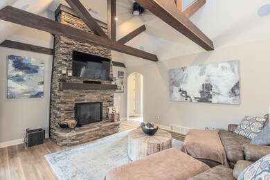 Hearth room with light hardwood / wood-style floor