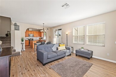 Open floor plan, the living room is light and bright with new flooring, gas fireplace, and large entertaining space.