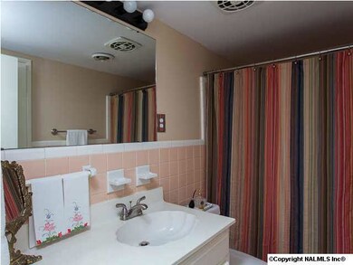 3/4 tiled bath with new plumbing fixtures.