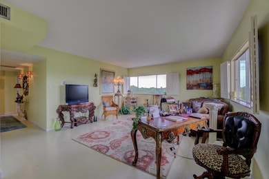 Living room featuring concrete flooring