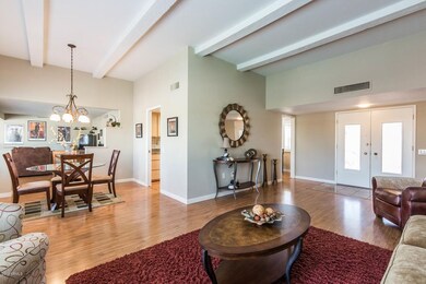 Living Room with Beam Ceiling
