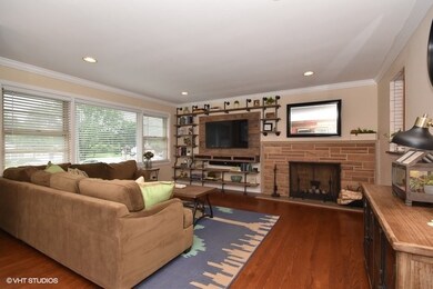 Hardwood floors and wood burning fireplace makes t