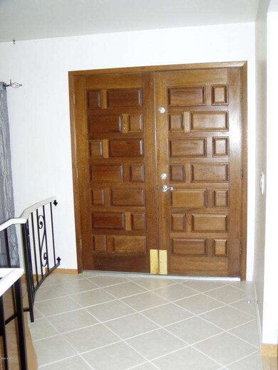 Double Front Doors into Tiled entry
