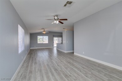 Spare room with visible vents, baseboards, light w