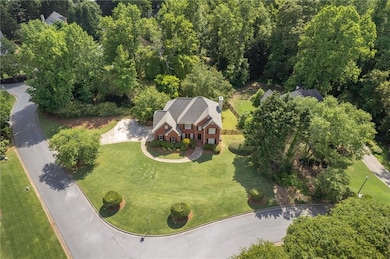 LOCATED ON A BEAUTIFUL CORNER LOT OVER 1/2 ACRE