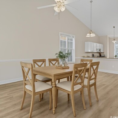 Dining area with light wood finished floors, baseb