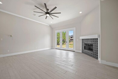 Unfurnished living room with ceiling fan, baseboa