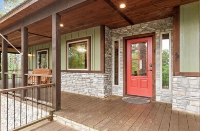 Doorway to property with covered porch