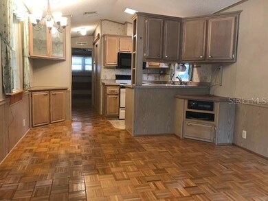 VIEW OF KITCHEN FROM LIVING ROOM