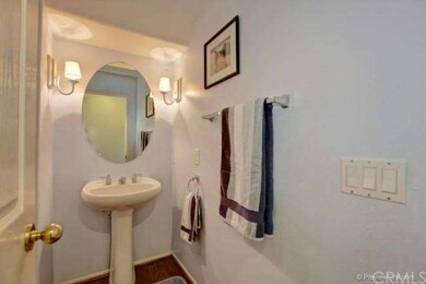 A view of the downstairs powder room located off t