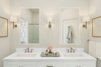 Primary bath with white-framed mirrors