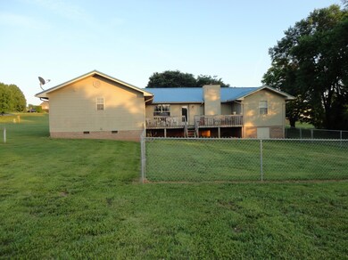 back view with fenced yard
