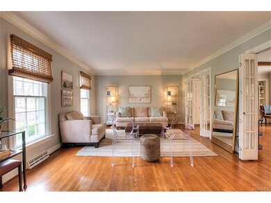 Chic family room with hardwood floors, crown mould