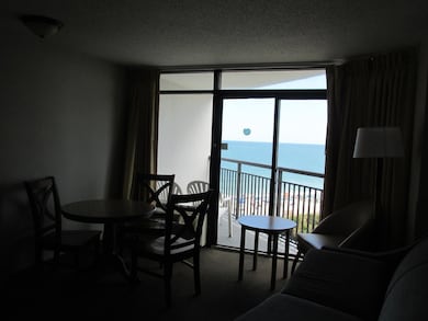 Dining room with a water view, expansive windows, 
