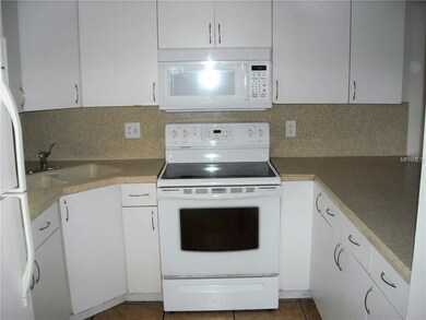 KITCHEN - Corian counters and backsplash.