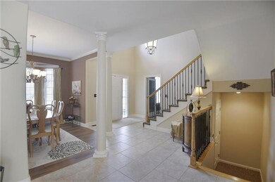 As you enter this beautiful 1.5 story home you are