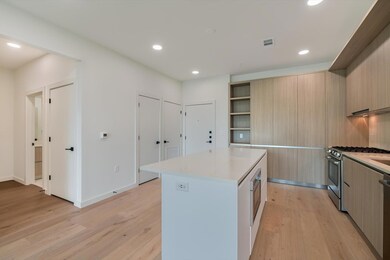 Kitchen with open shelves, modern cabinets, a cen