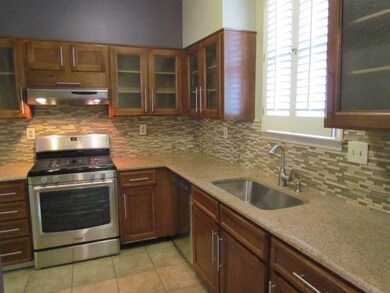 Gourmet kitchen with gas cooking, granite, custom 